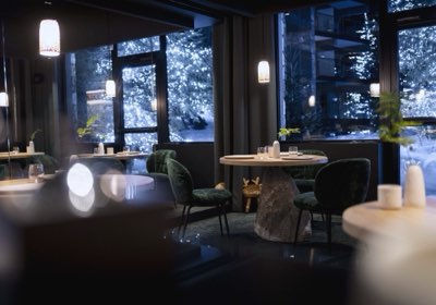 A table at Alpage, the forest behind the windows